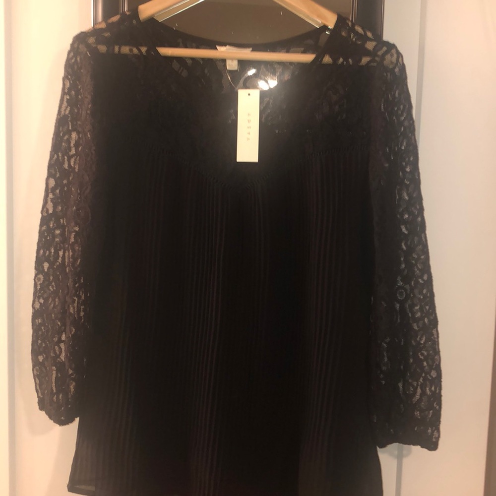 Dressy black shirt with lace sleeves.